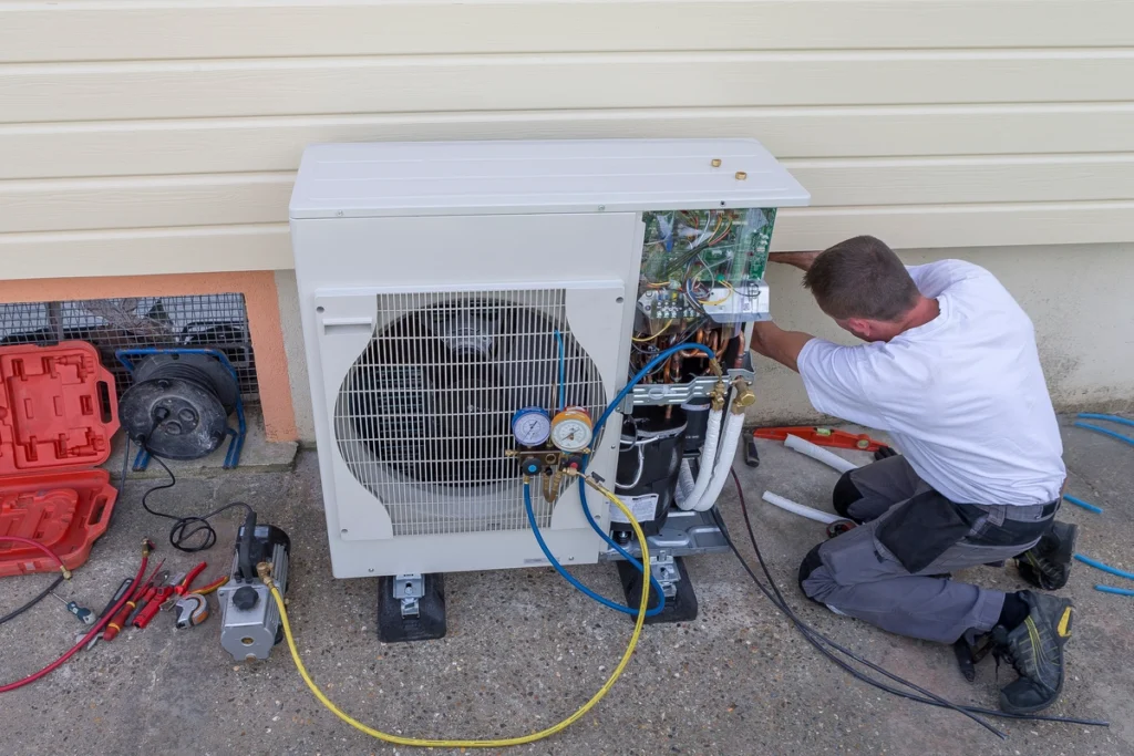 HVAC technician working on a heat pump