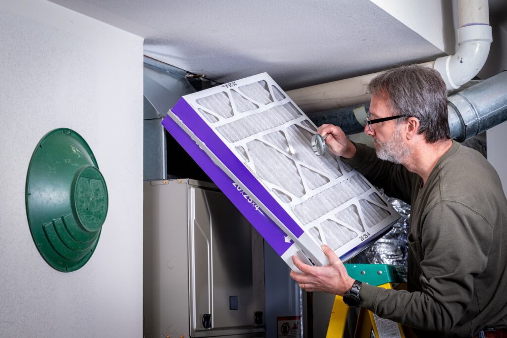 Resident inspects his filter for cleanliness