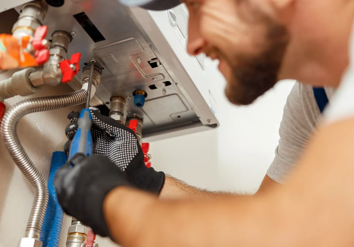 close up of tech using hand tools for hvac maintenance