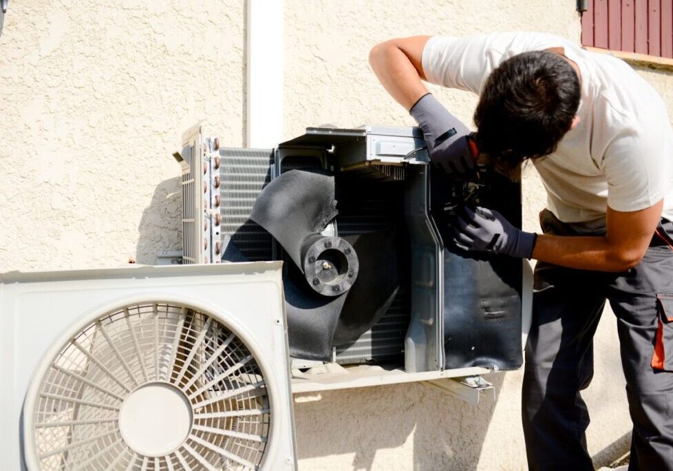 outdoor ac unit not turning on young worker using white clothes repairing unit air conditioner home